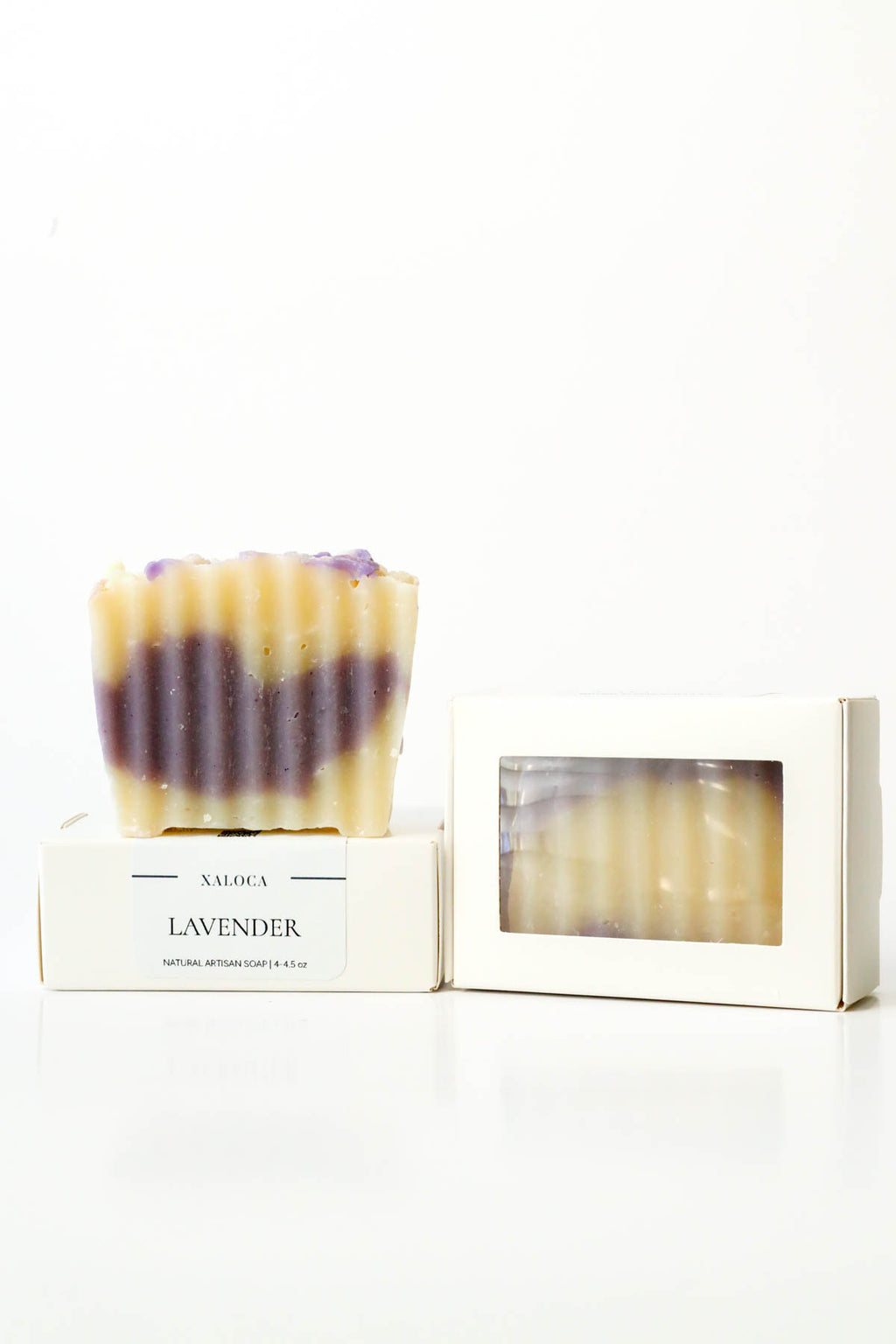 Lavender soap bar with packaging on a white background