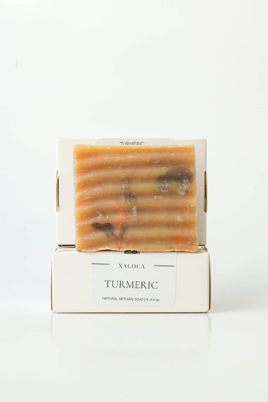 Bar of soap in a white box with 'Maloka' branding on a white background