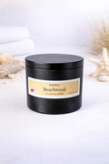 Black candle jar labeled 'Beachwood' with Xaloca branding on a white background.
