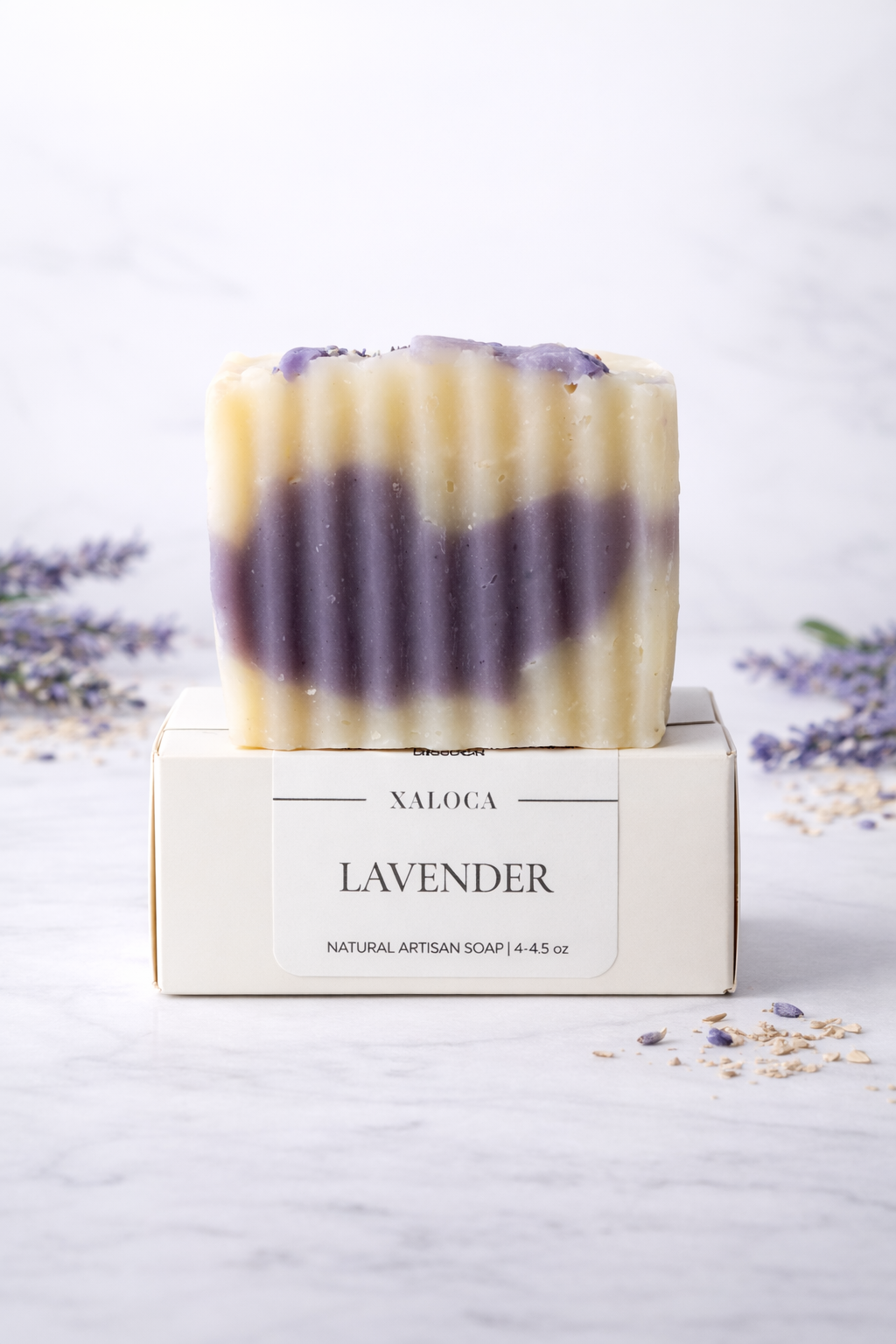 Lavender soap bar on a white background with Xaloca branding
