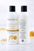 Two bottles of Xaloca Oatmeal Milk & Honey Lotion on a white background