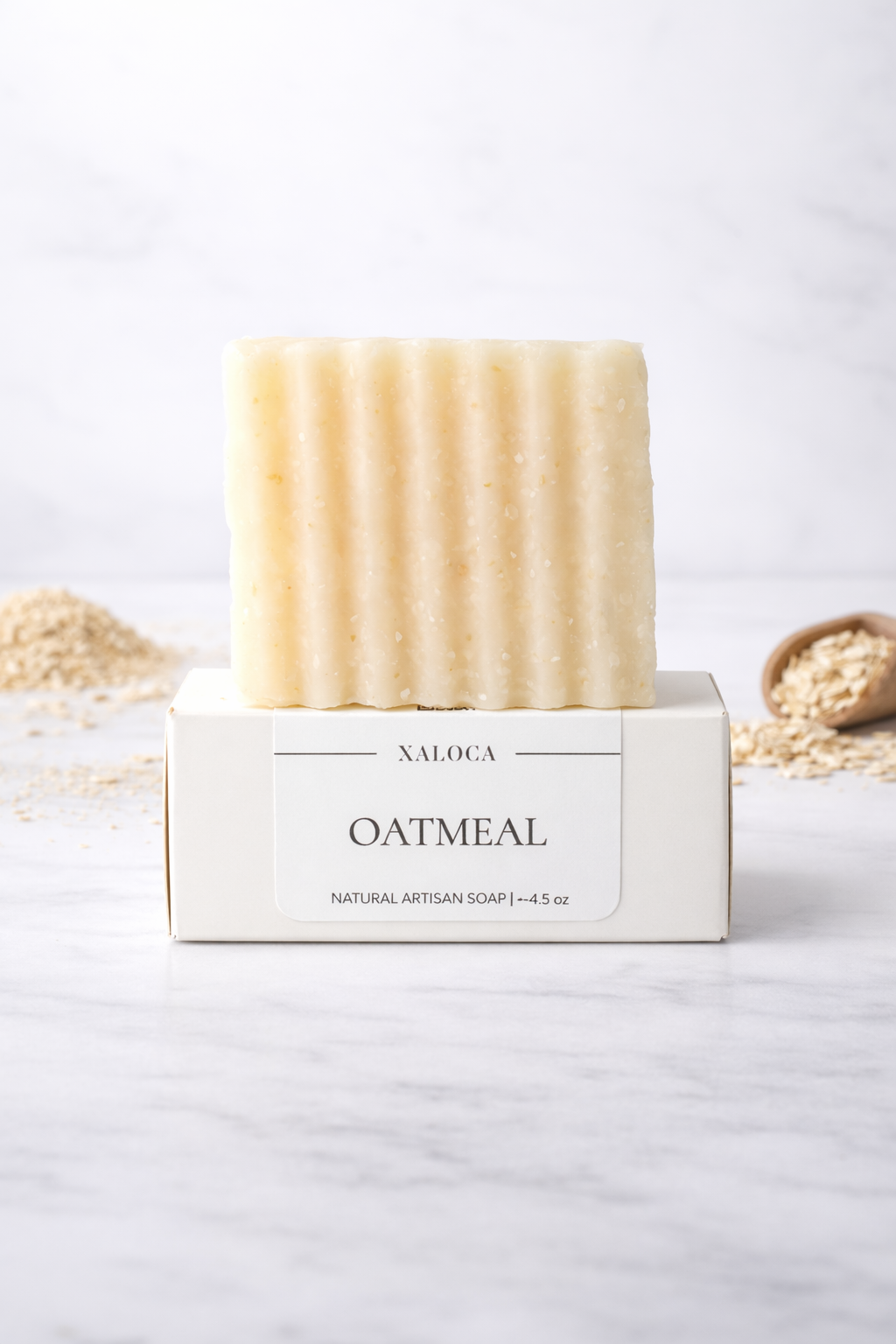 Bar of oatmeal soap in a white box on a light background