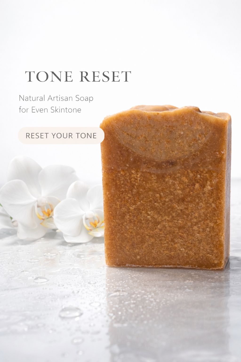 Brown bar of soap on a light surface with white flowers in the background, labeled 'Tone Reset'.